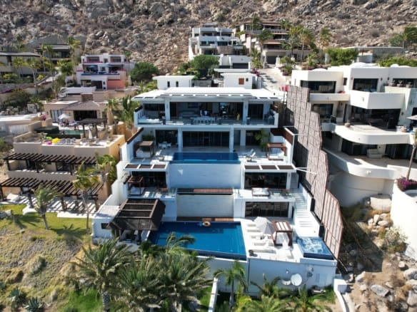 Aerial view of stunning modern villas in Cabo San Lucas with ocean views. — Woods Cove real estate